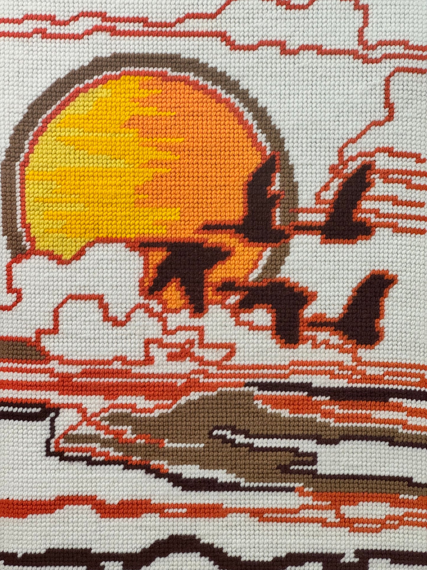 1970s tapestry picture of flying geese in a sunset