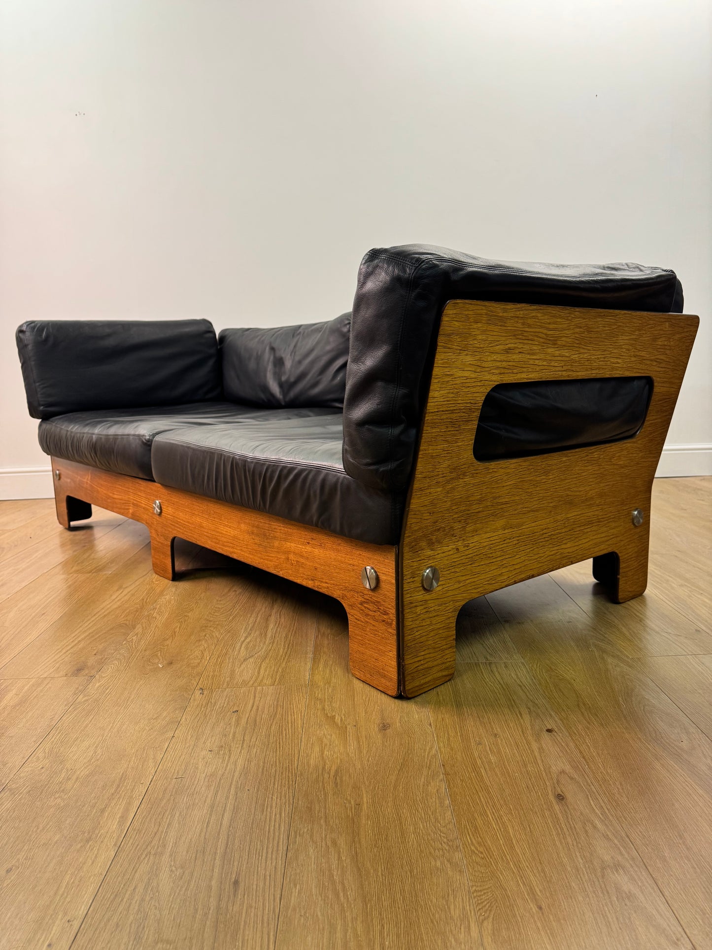 Plywood and Leather sofa designed by John Hardy