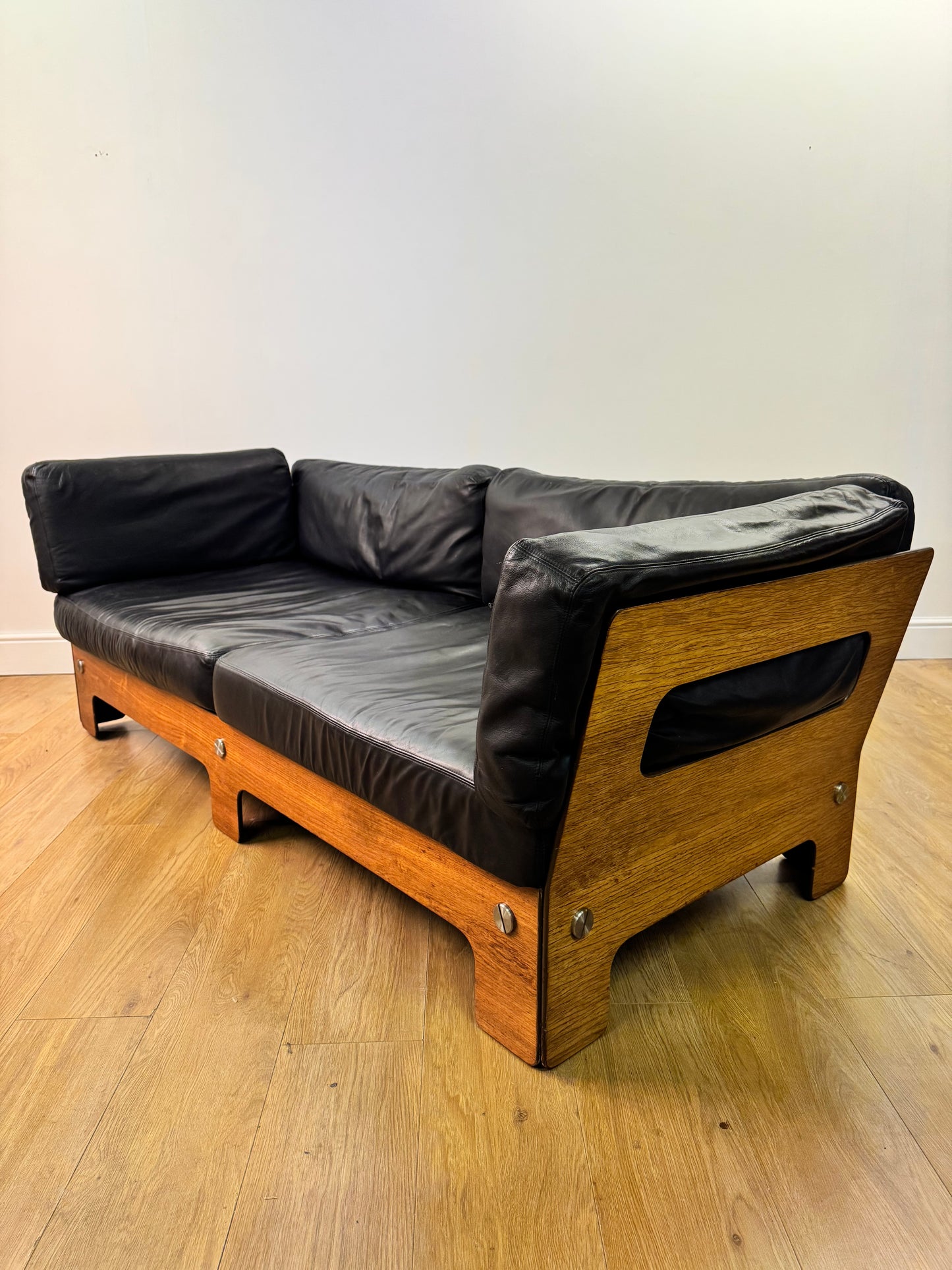 Plywood and Leather sofa designed by John Hardy