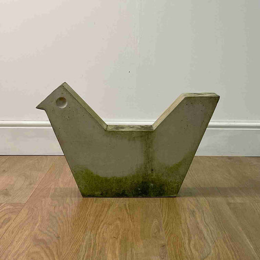 Brutalist concrete bird sculpture