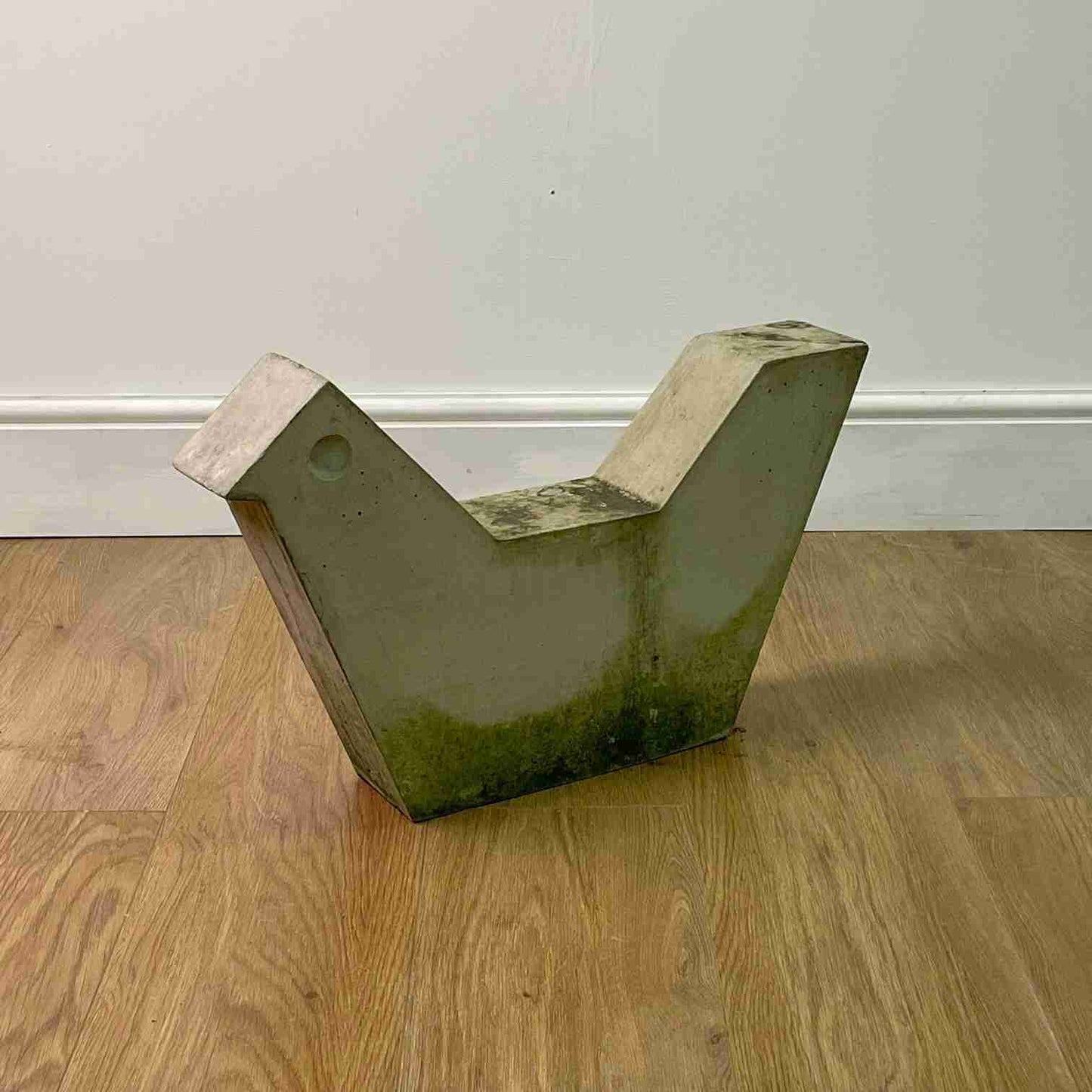 Brutalist concrete bird sculpture