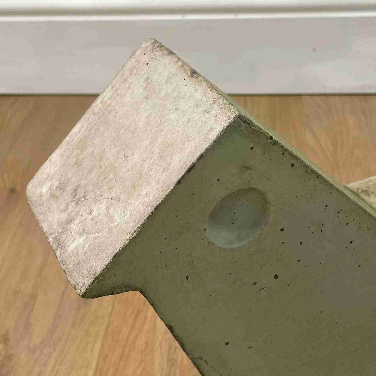 Brutalist concrete bird sculpture