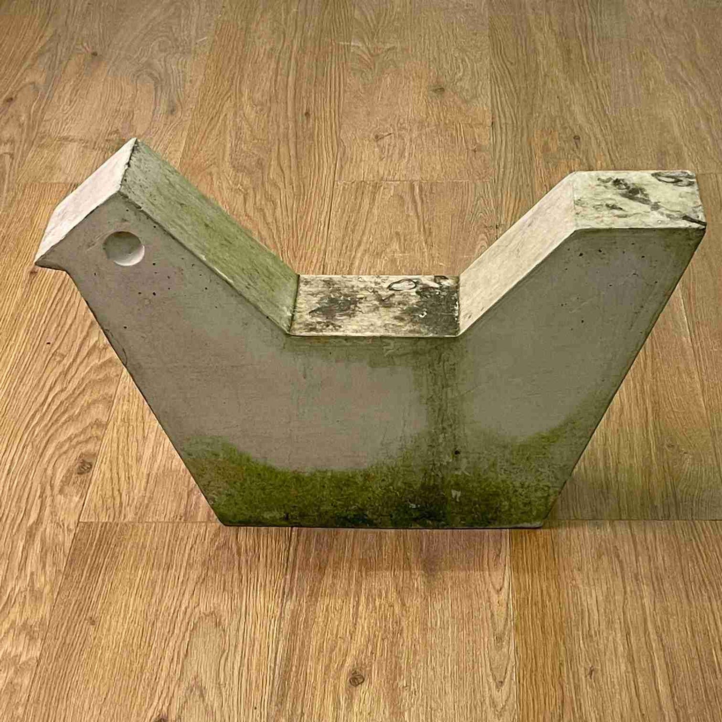 Brutalist concrete bird sculpture