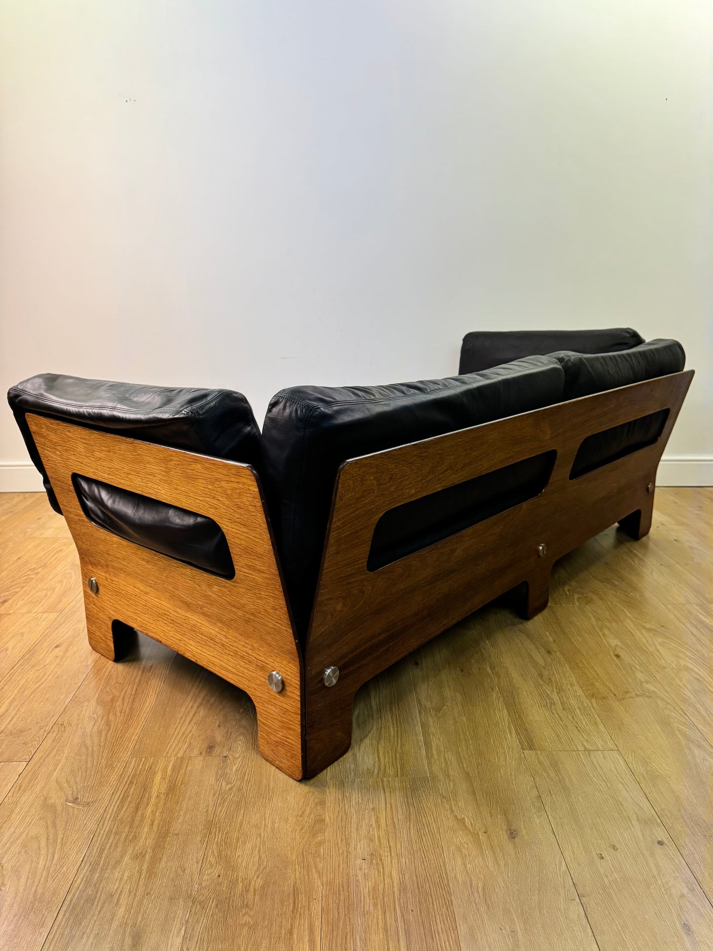 Plywood and Leather sofa designed by John Hardy