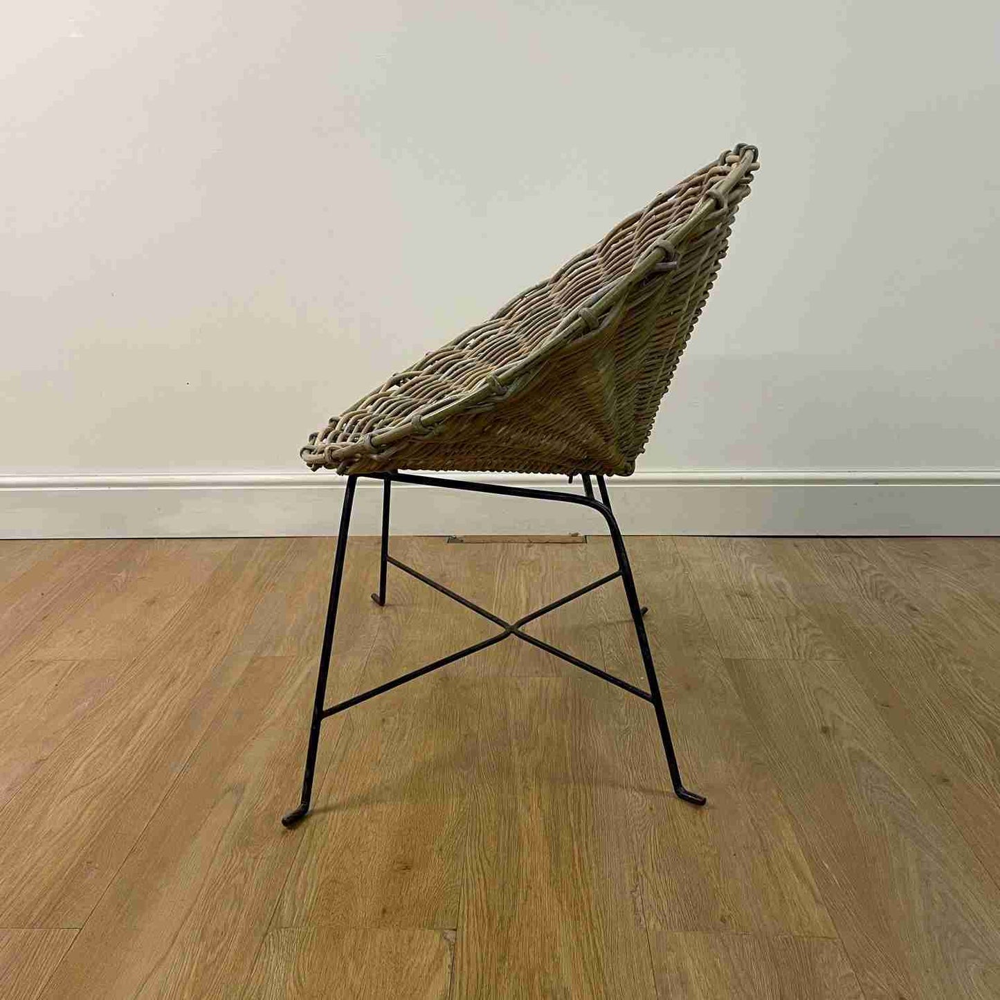 Conran style basket weave chair on black steel legs