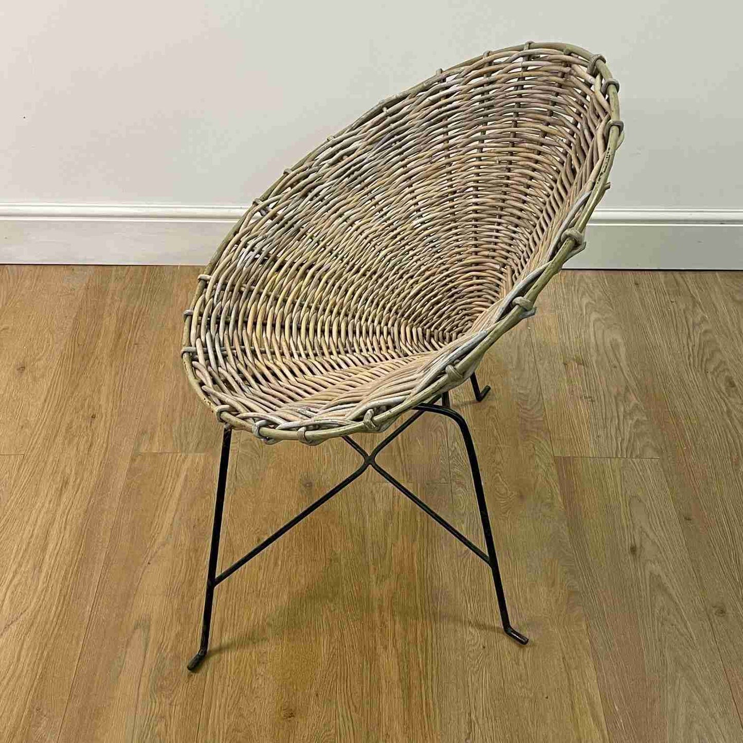 Conran style basket weave chair on black steel legs