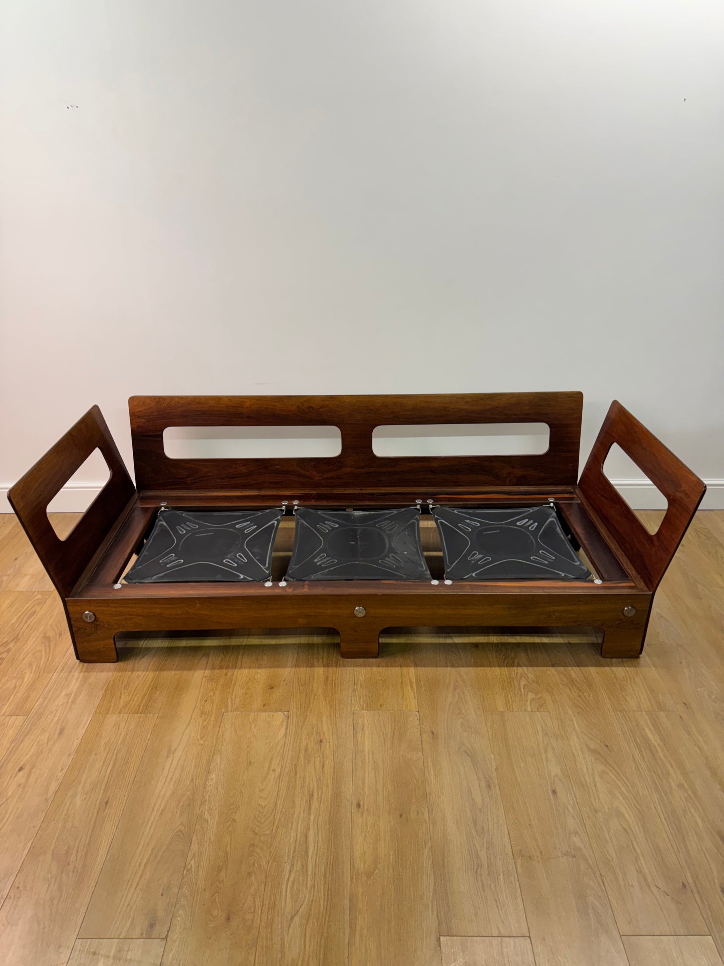 Plywood and Leather sofa designed by John Hardy