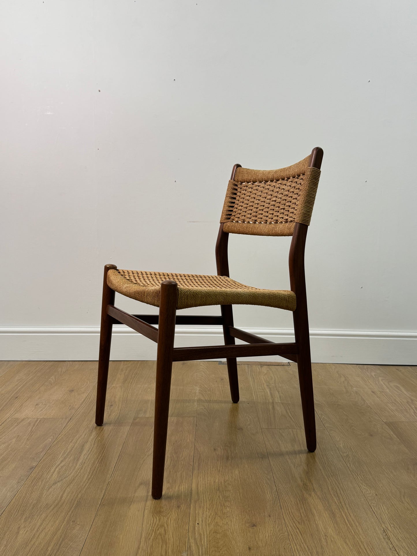 Set of two Danish teak dining chairs with corded seats