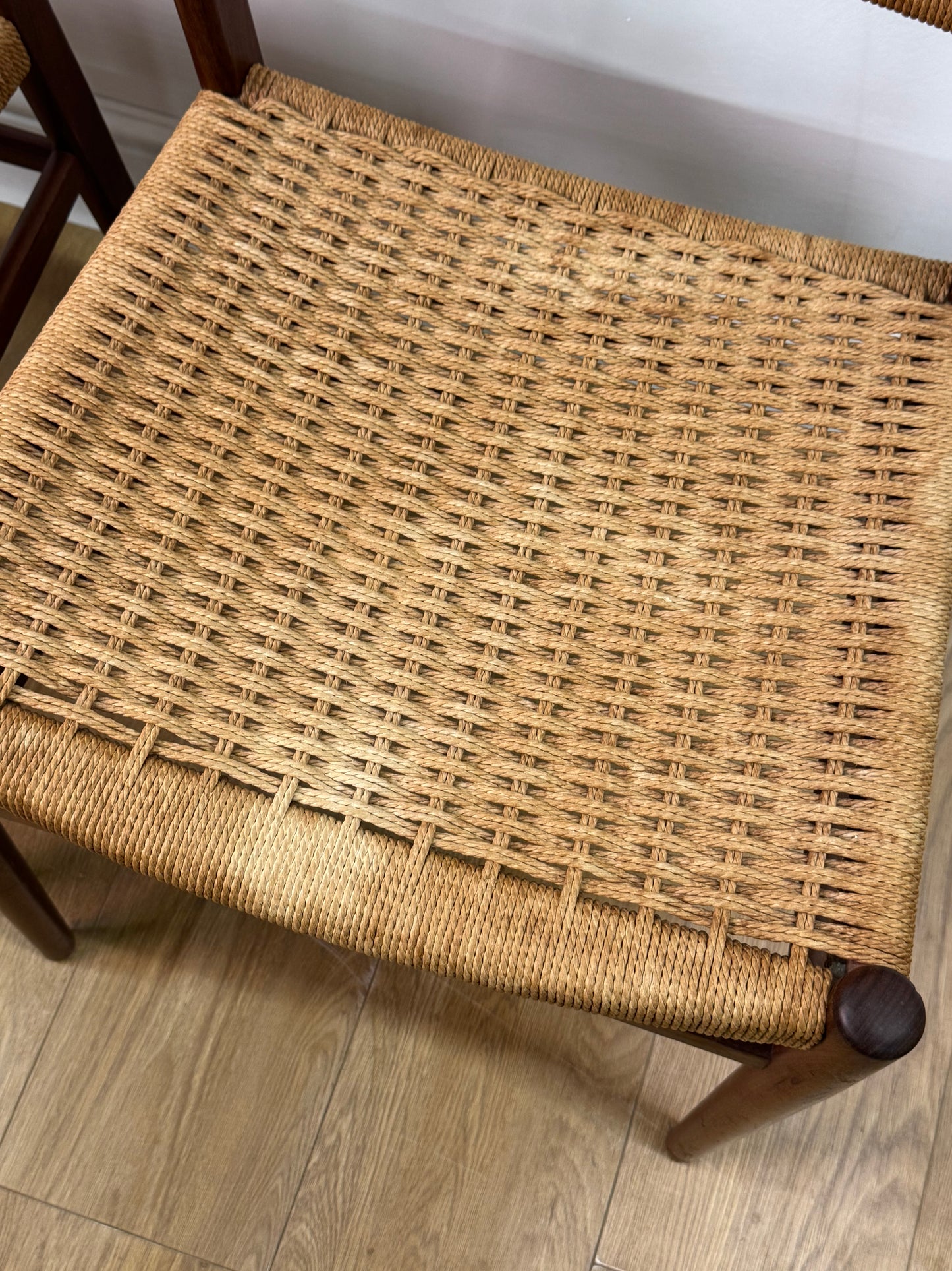 Set of two Danish teak dining chairs with corded seats