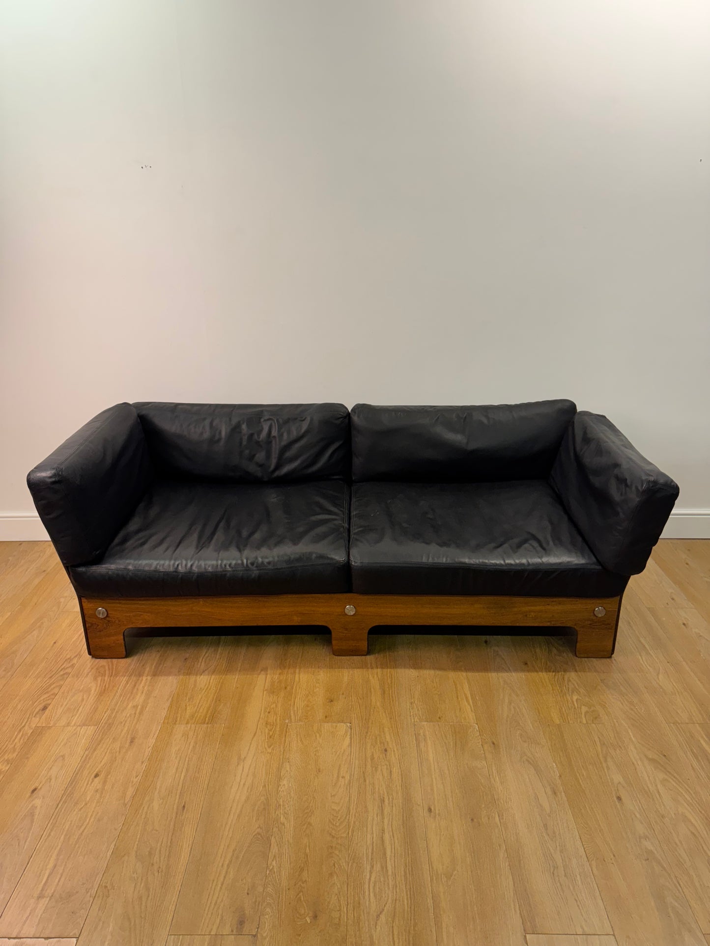 Plywood and Leather sofa designed by John Hardy