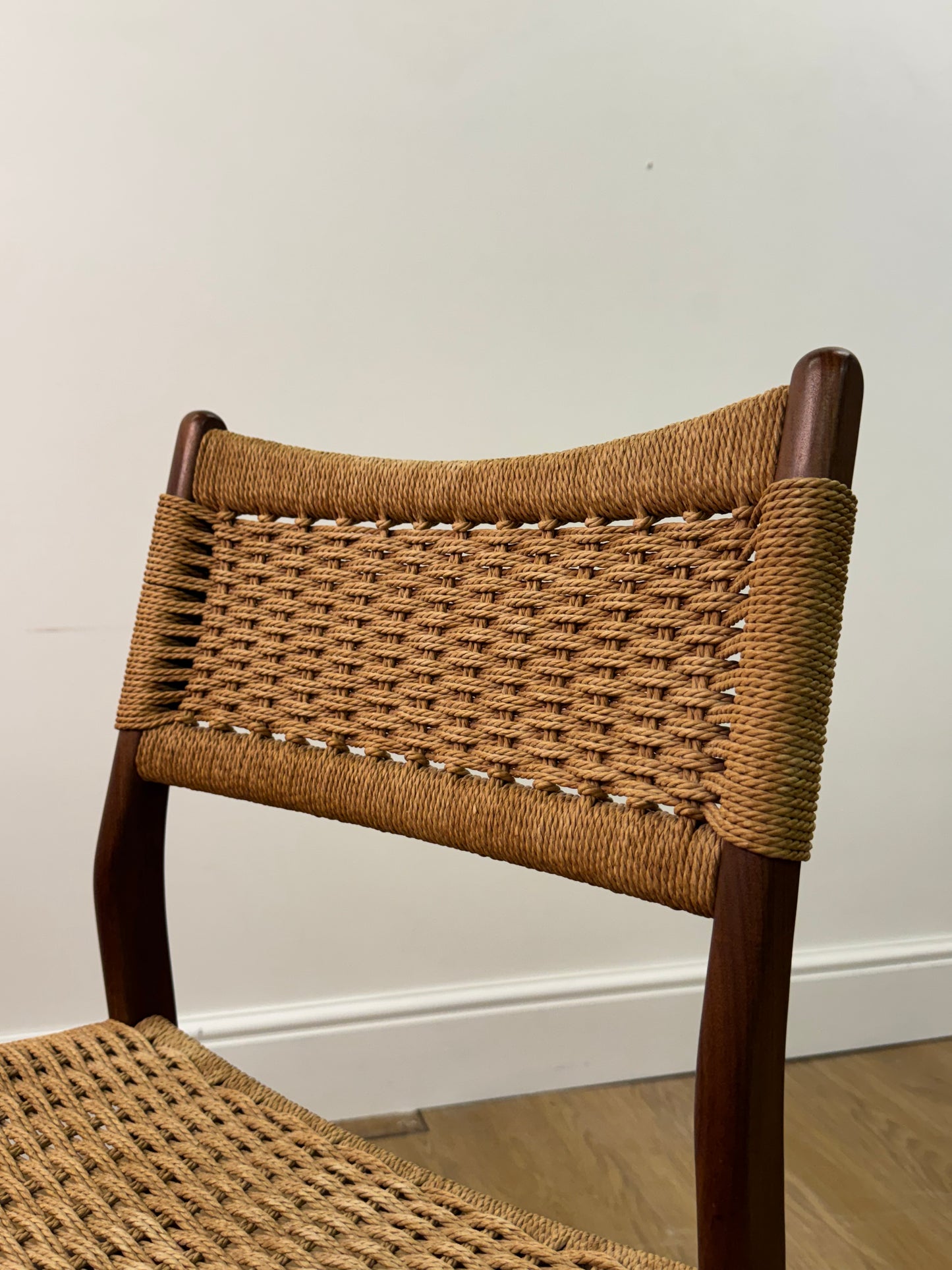 Set of two Danish teak dining chairs with corded seats