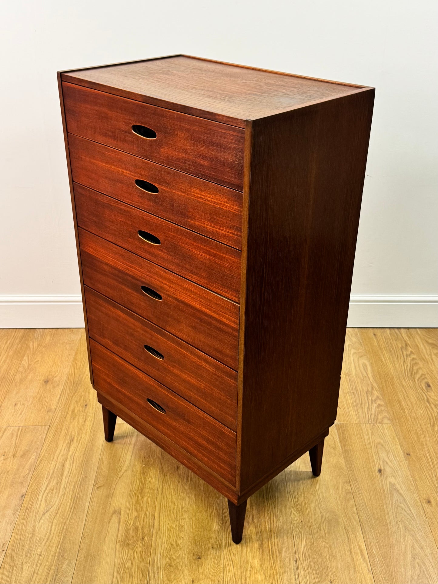 Tall teak chest of drawers by Frank Guille