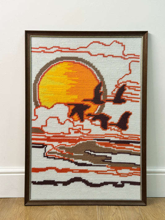 1970s tapestry picture of flying geese in a sunset