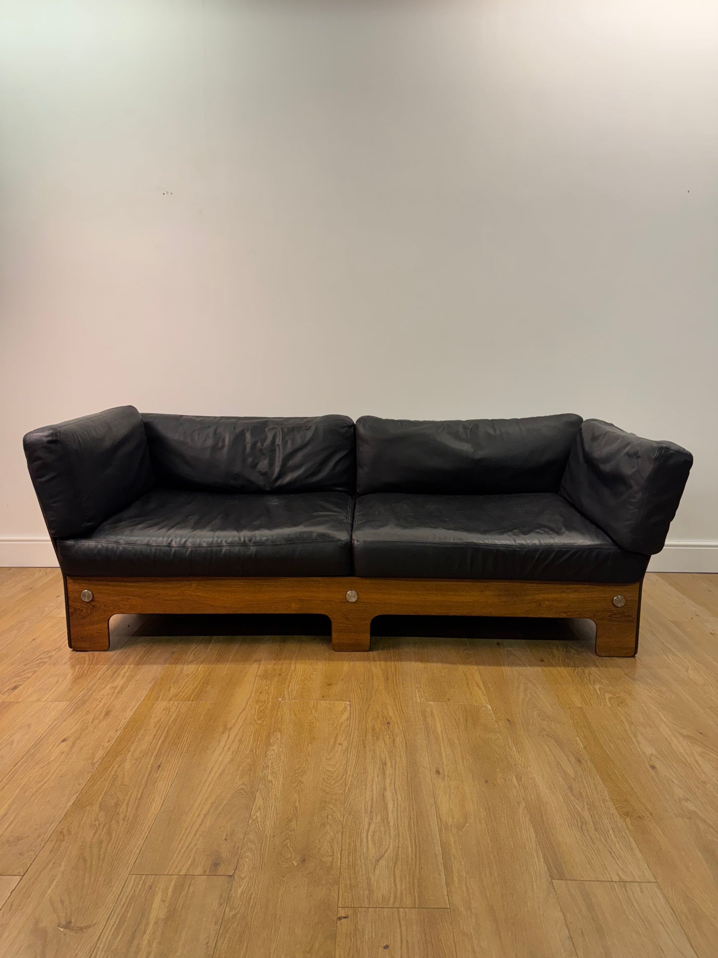 Plywood and Leather sofa designed by John Hardy