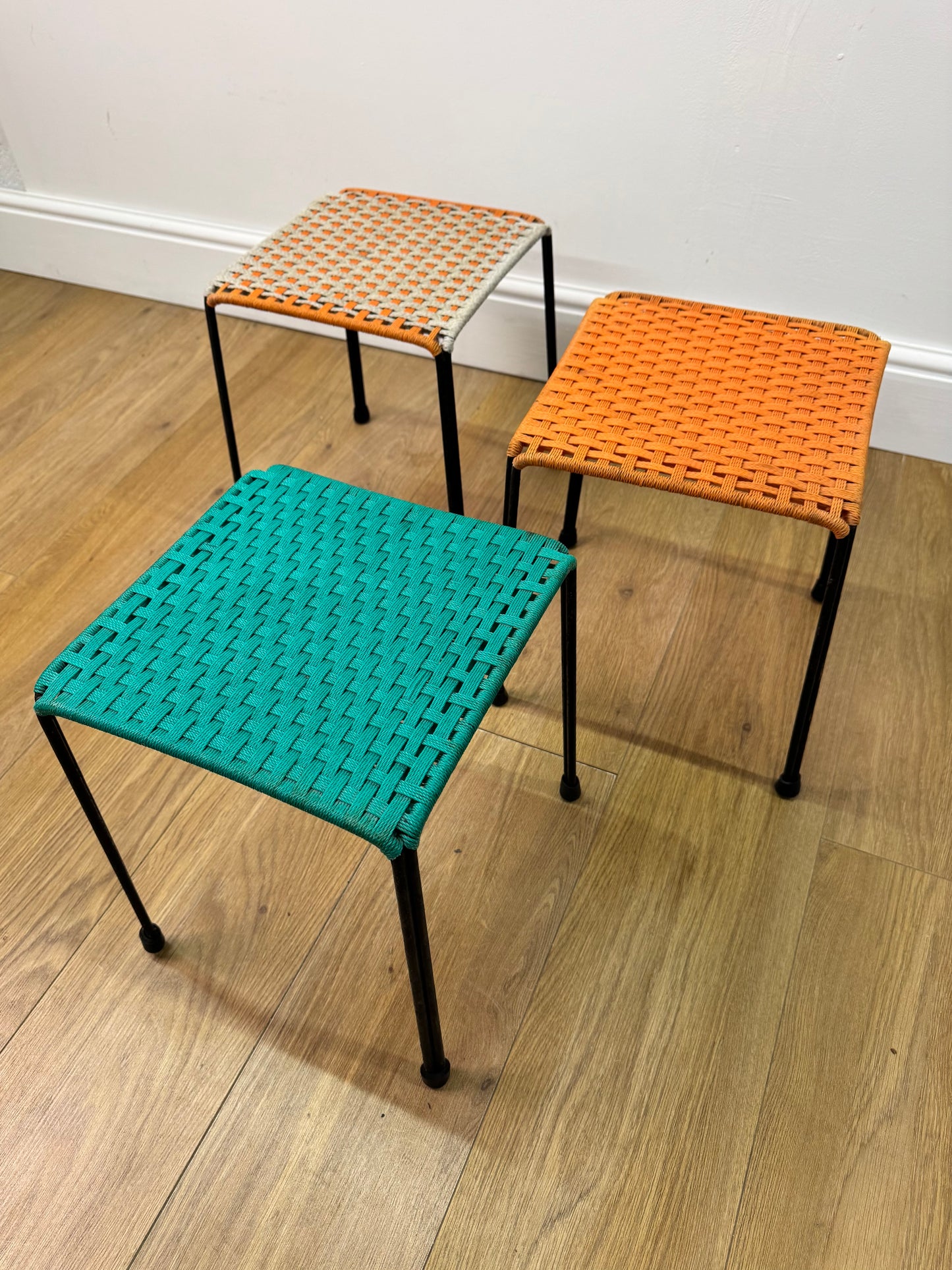 1950s woven stools on metal legs
